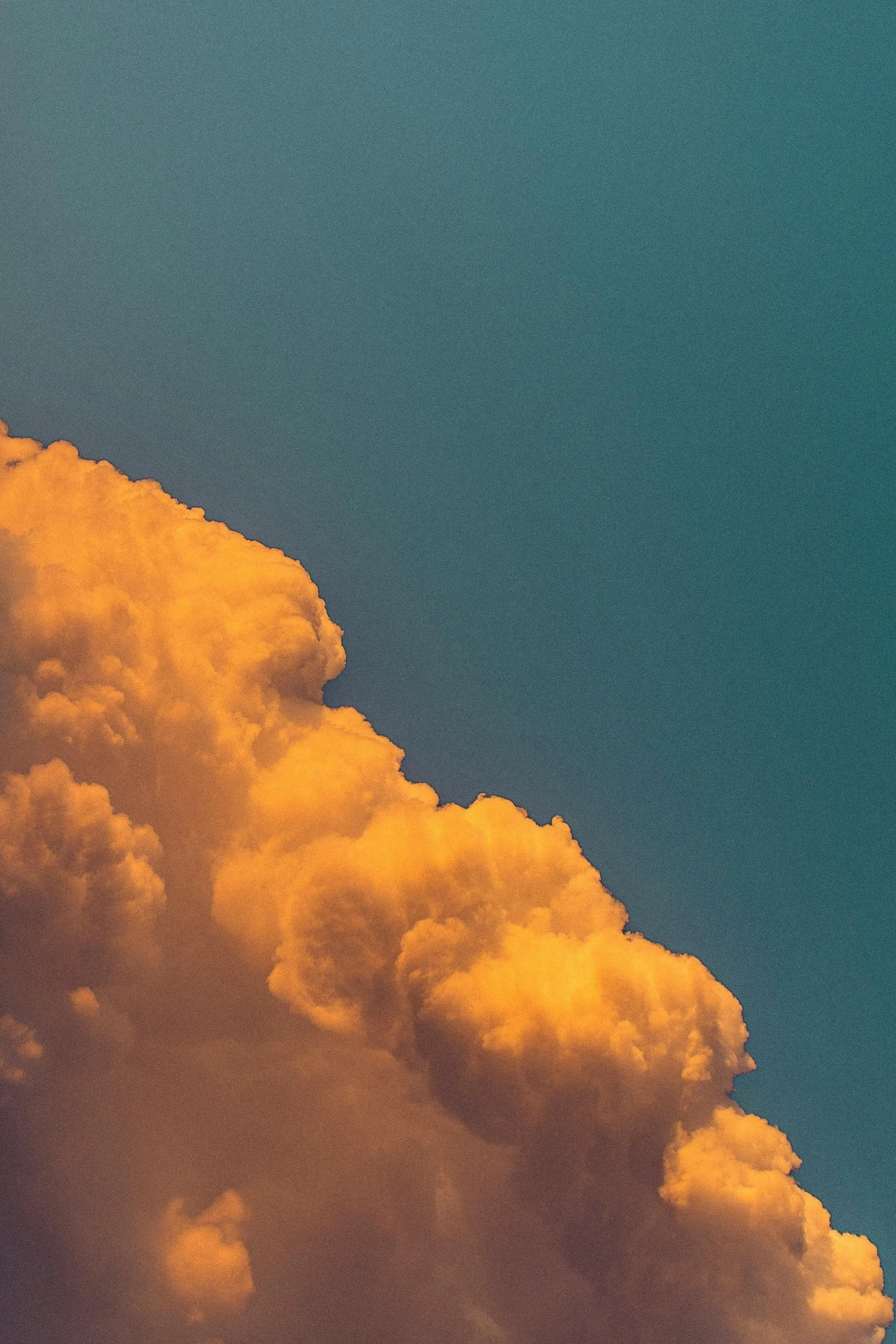 A bright orange cloud representing what you picture when you hear Cloudflare